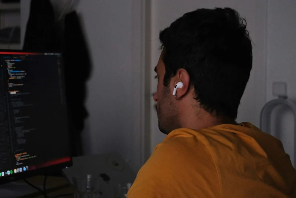 Person coding on a computer